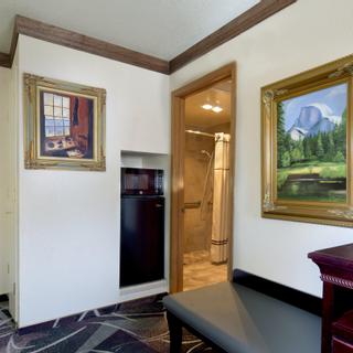 Best Western Plus Yosemite Gateway Inn | Oakhurst, California | View of accessible bathroom from bedroom with nature artwork on wall
