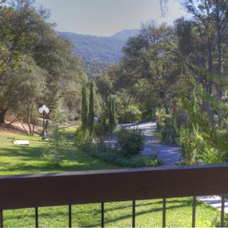 Best Western Plus Yosemite Gateway Inn | Oakhurst, California | View of nature-filled grounds from balcony